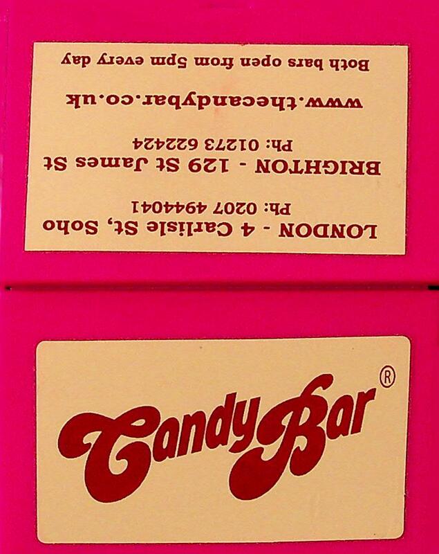 Small pink plastic box/ cards holder. Text contains contact information and address details for both the Brighton and London locations. 
